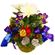 New Year Carnival. A special New Year arrangement of irises, mums and holiday decoration in a basket.